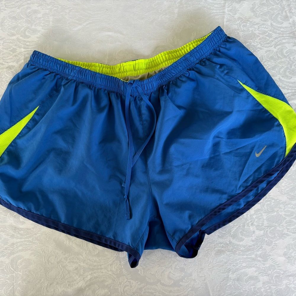 Nike blue and neon yellow woman’s athletic shorts size xl